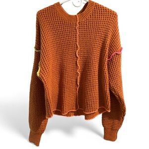 New In Rust Orange Inside Out Colored Seams Sweater- Size Small